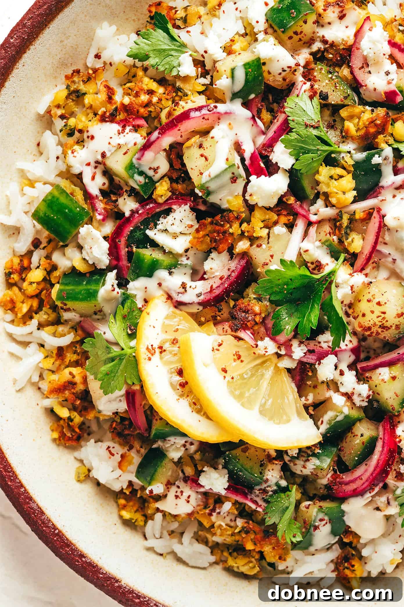A close-up of the crumbled falafel texture, golden and crispy.
