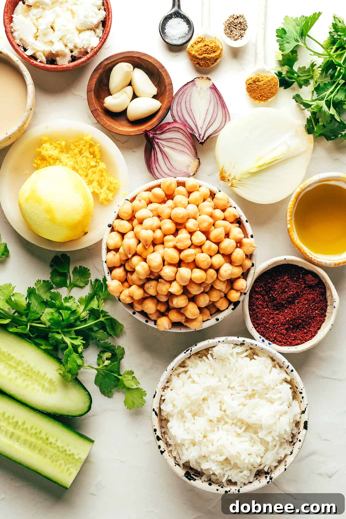 Close-up of crispy crumbled falafel in a bowl with fresh ingredients.