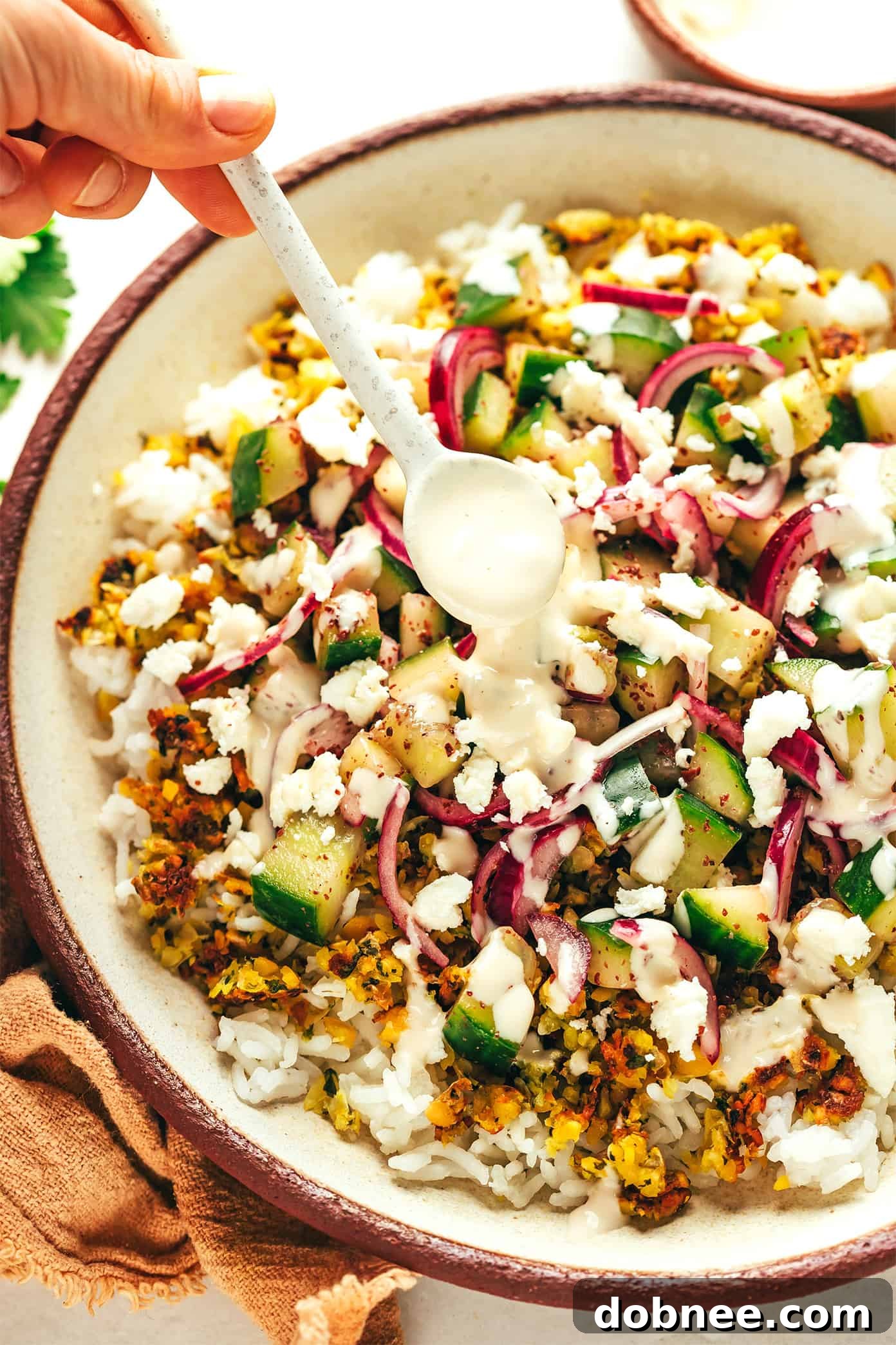 A beautifully composed Crumbled Falafel Bowl, ready to be enjoyed.