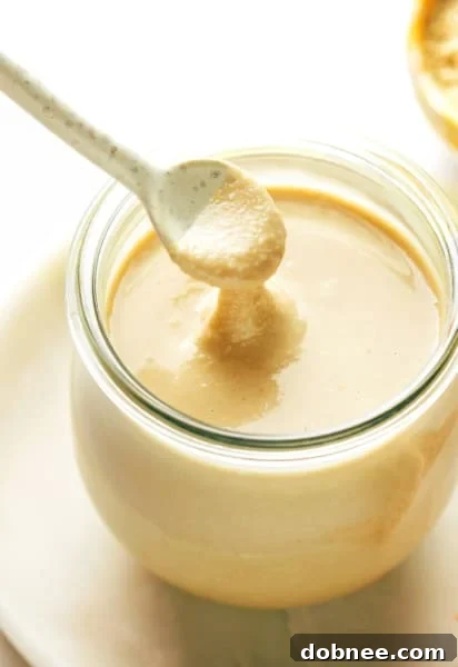 Homemade Tahini in Jar, a perfect example of creamy, fresh sesame paste.
