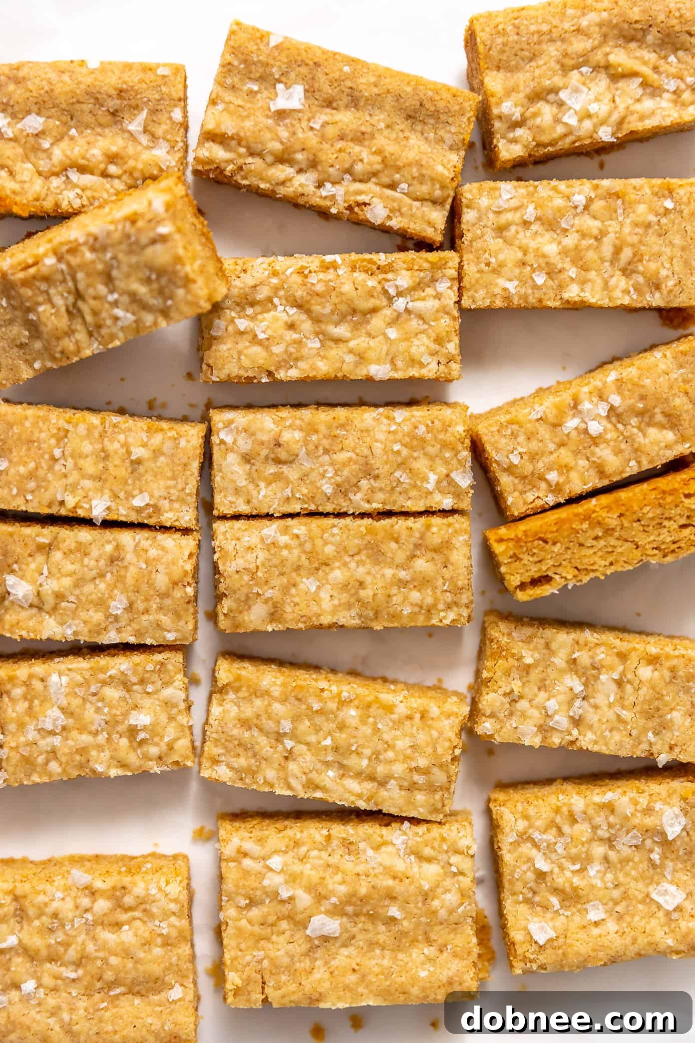 Golden brown butter shortbread bars on a white background, viewed from above