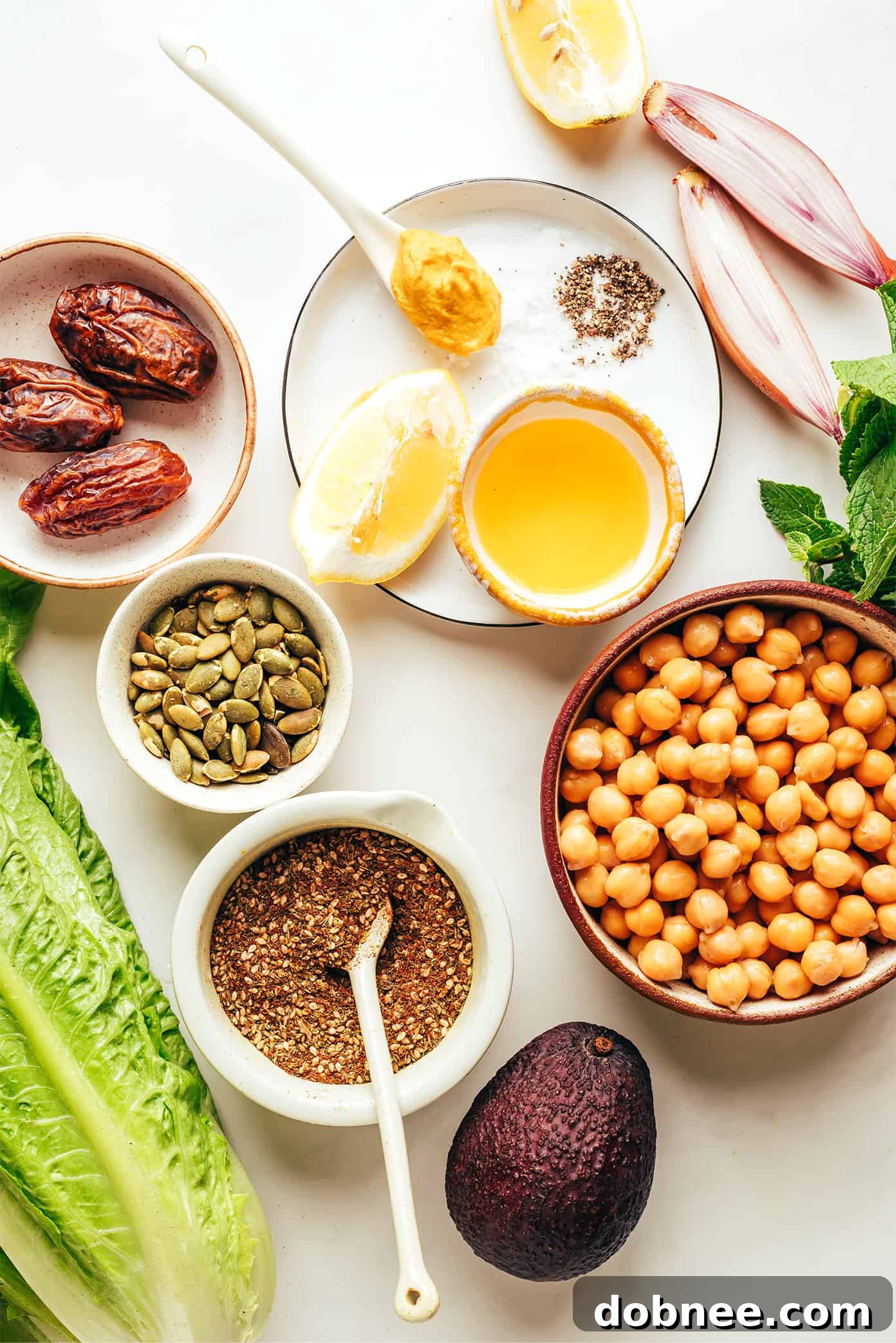 Close-up of fresh, colorful ingredients for the Chickpea, Date, and Avocado Salad laid out before preparation.