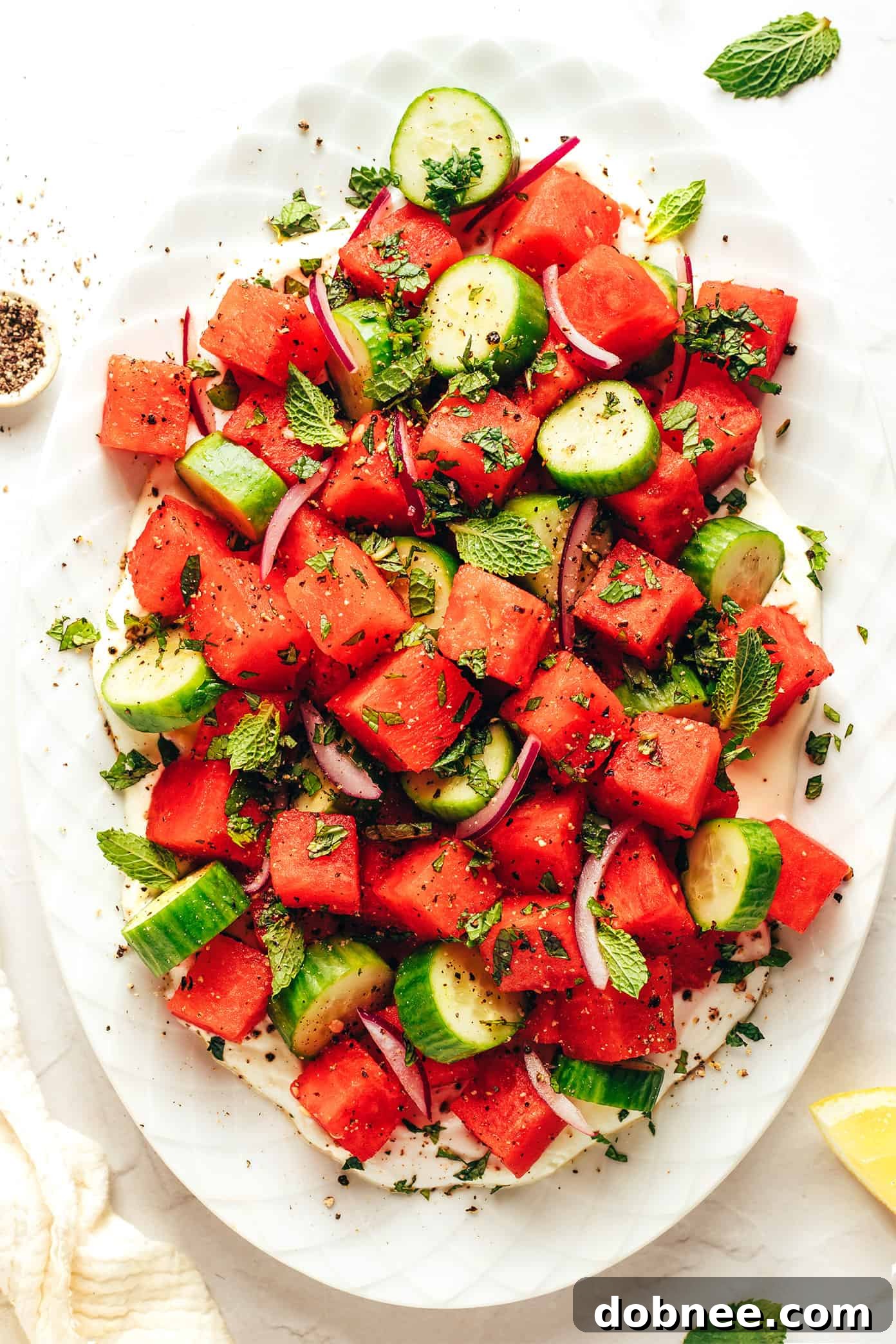 Beautifully presented Watermelon Feta Salad with a generous layer of whipped feta