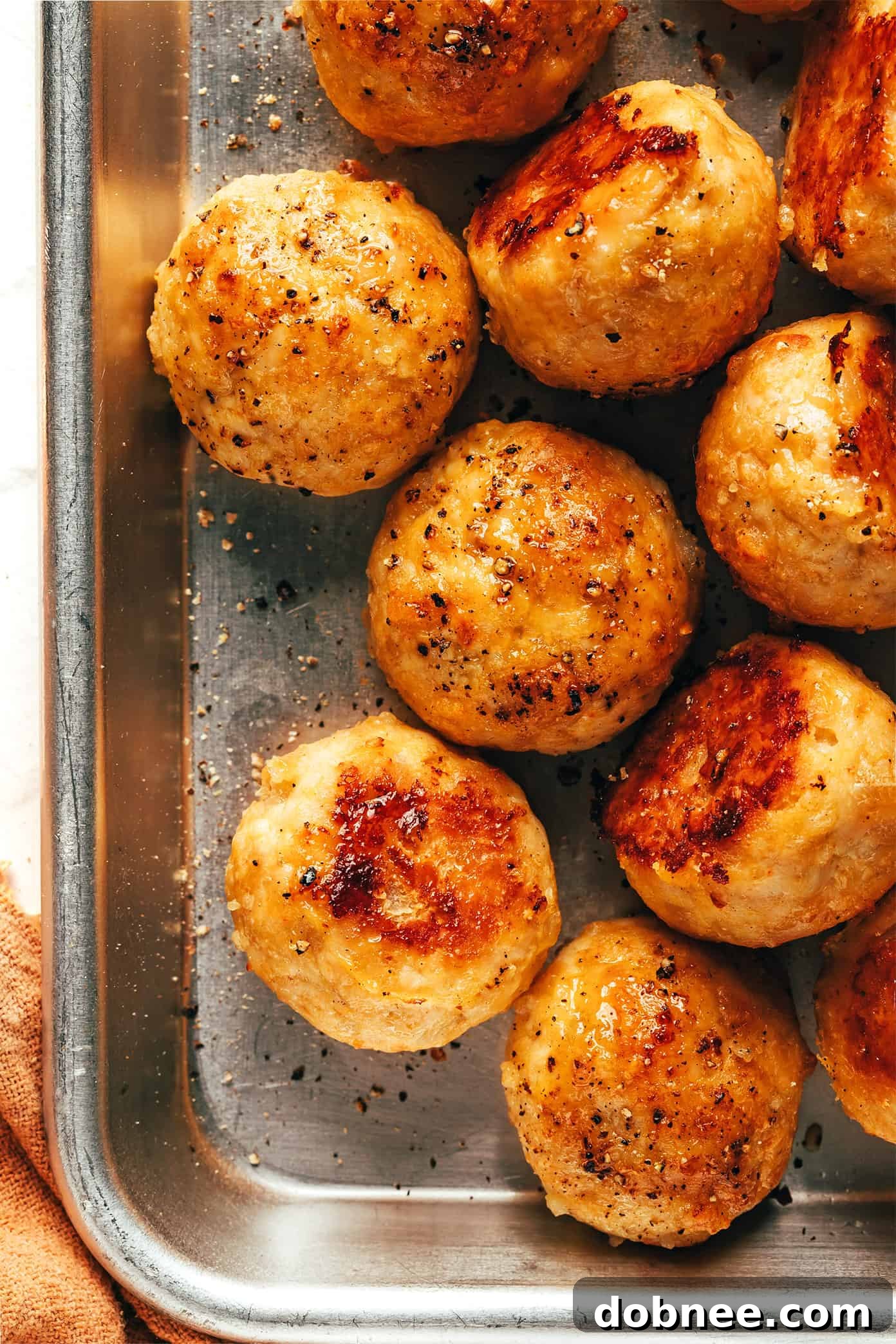 Close-up of baked chicken meatballs in a bowl