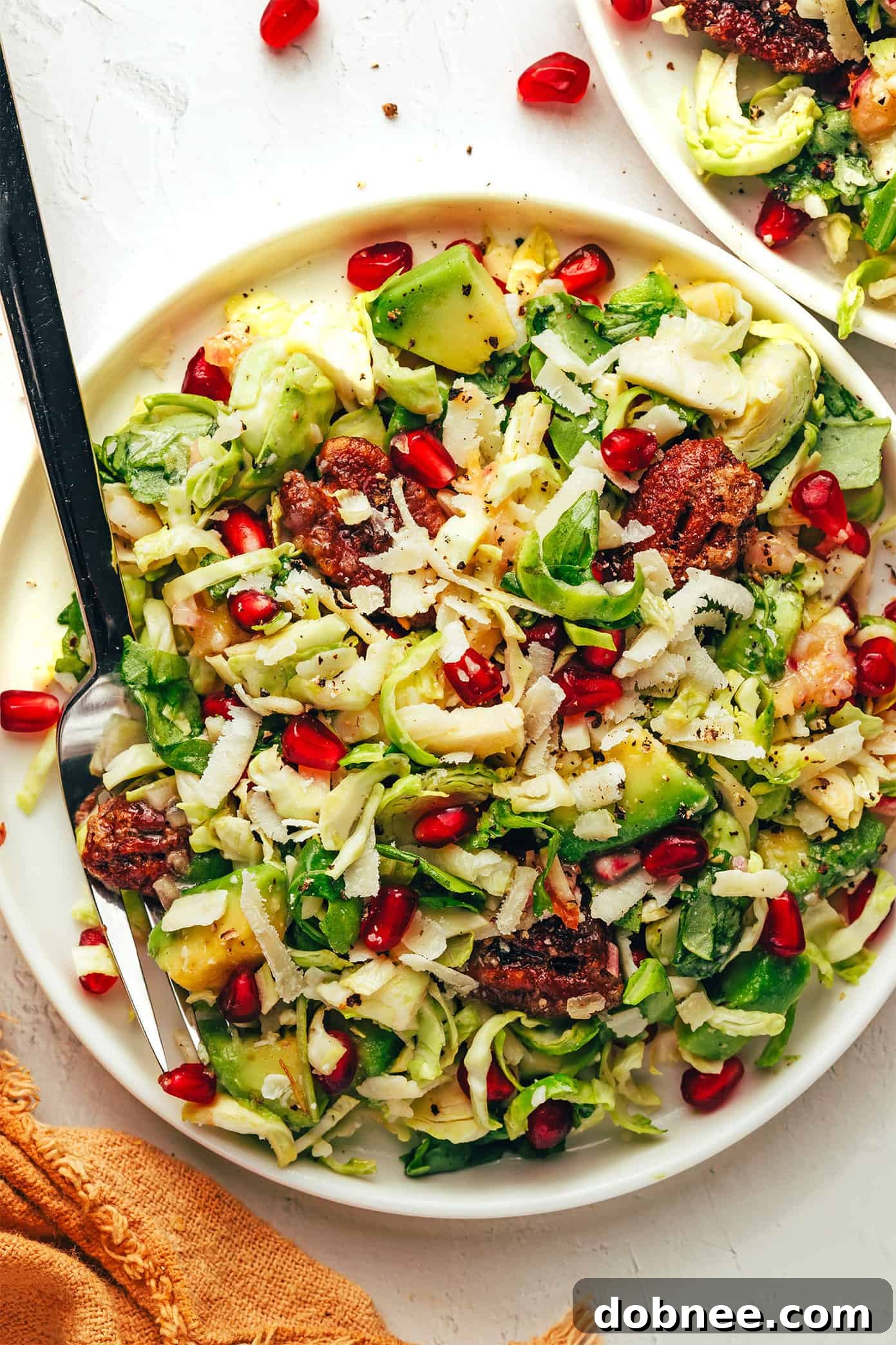 Brussels Sprouts Arugula Salad with Pomegranate and Parmesan, overhead shot