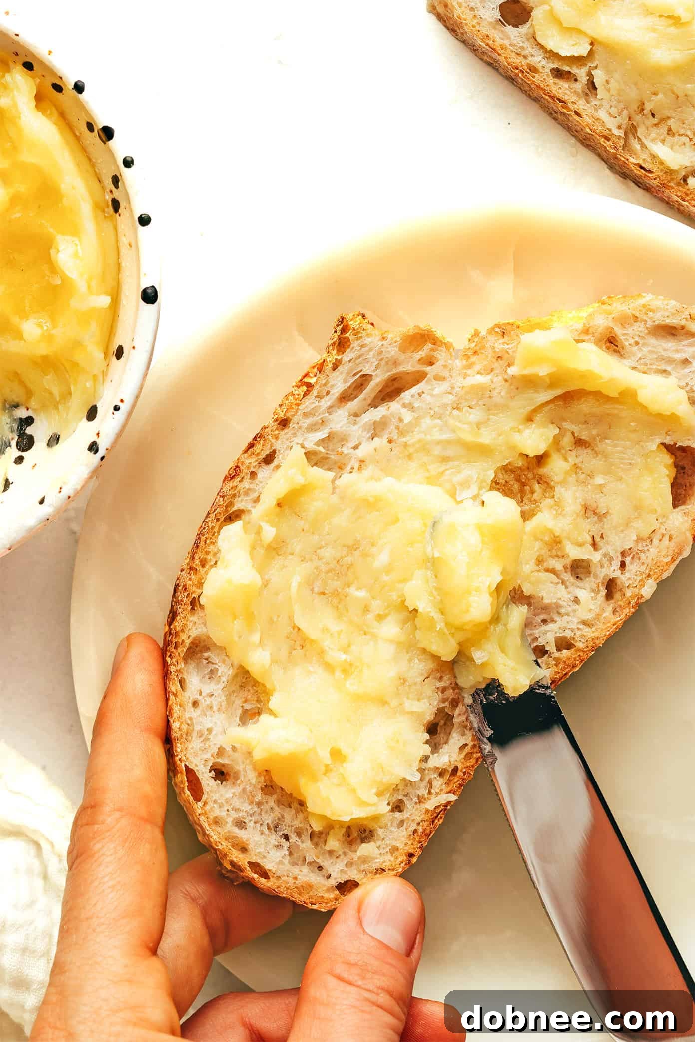 Freshly whipped salted honey butter in a small white bowl, ready to be served