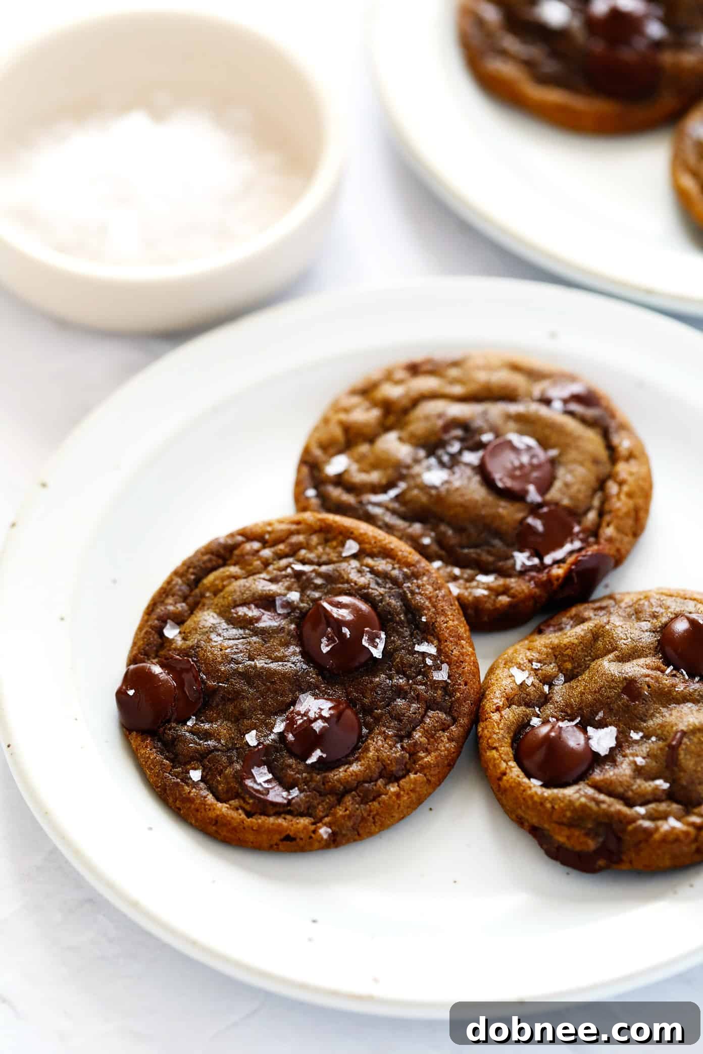 A wooden board filled with baked espresso chocolate chip cookies, ready to be enjoyed.