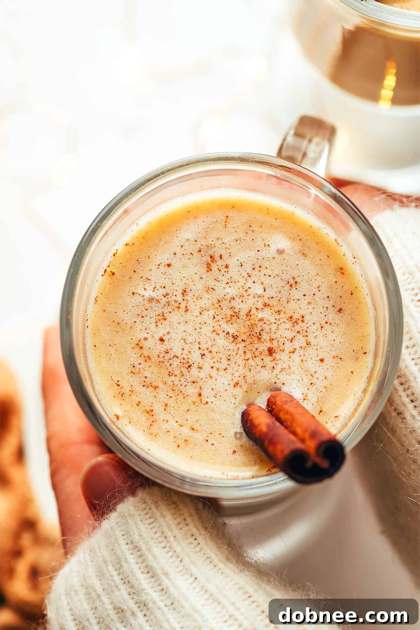 A festive spread of warm winter drinks, including hot buttered rum, hot toddy, and mulled wine, inviting cozy gatherings.