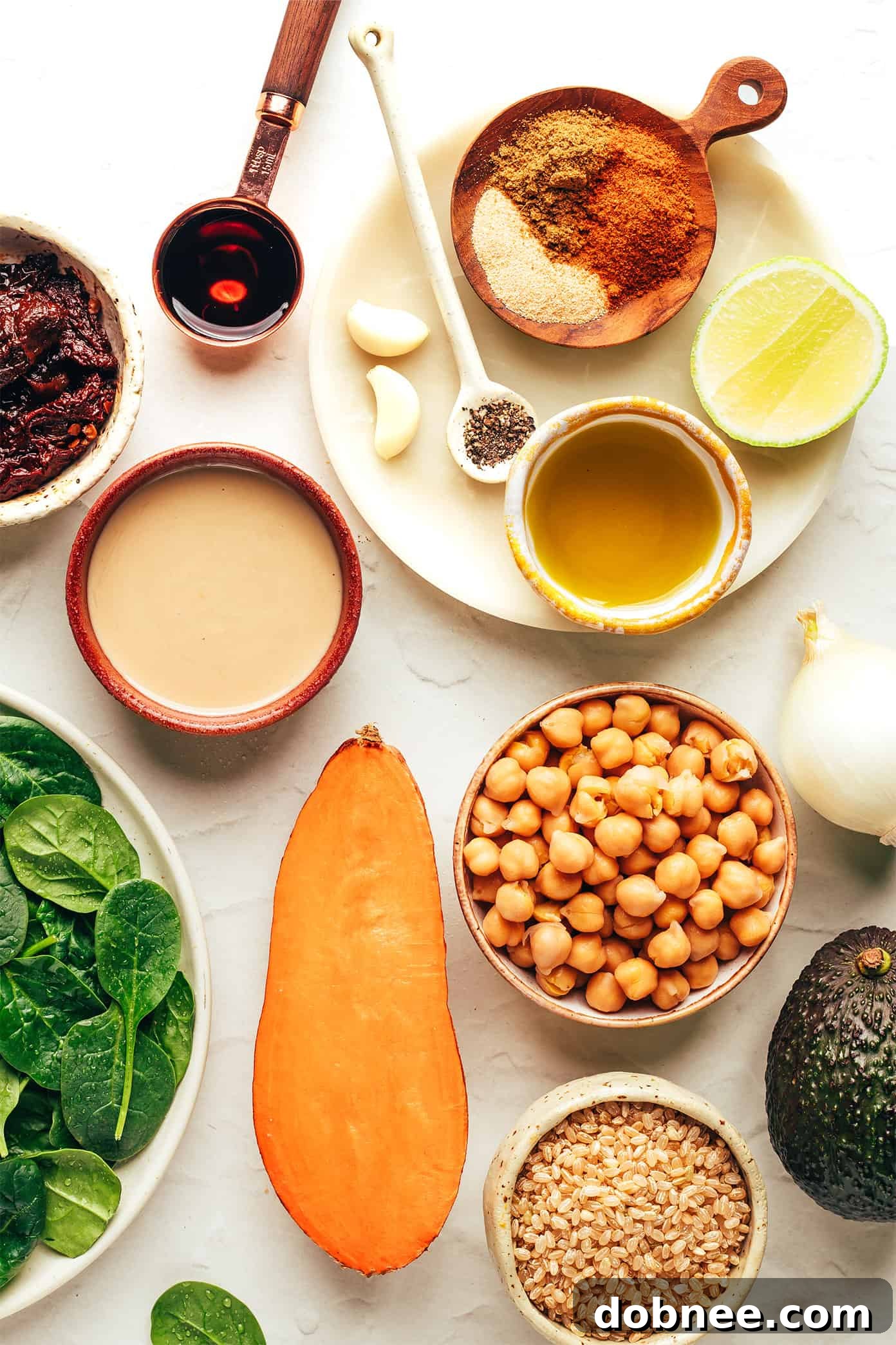 A close-up of the roasted sweet potatoes and chickpeas, seasoned and ready for the bowls.