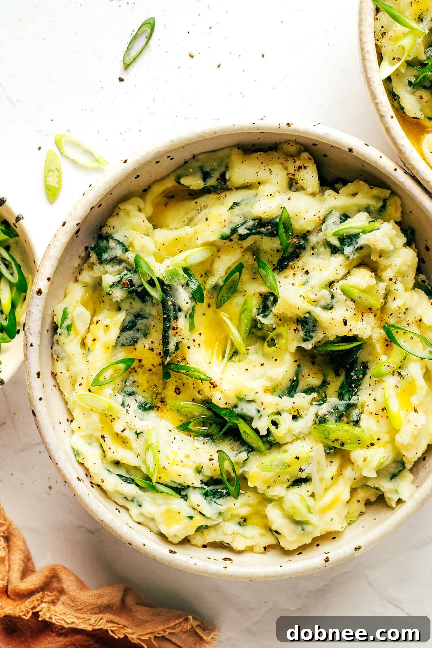 A close-up shot of a pot filled with freshly mashed Colcannon, ready to be portioned.