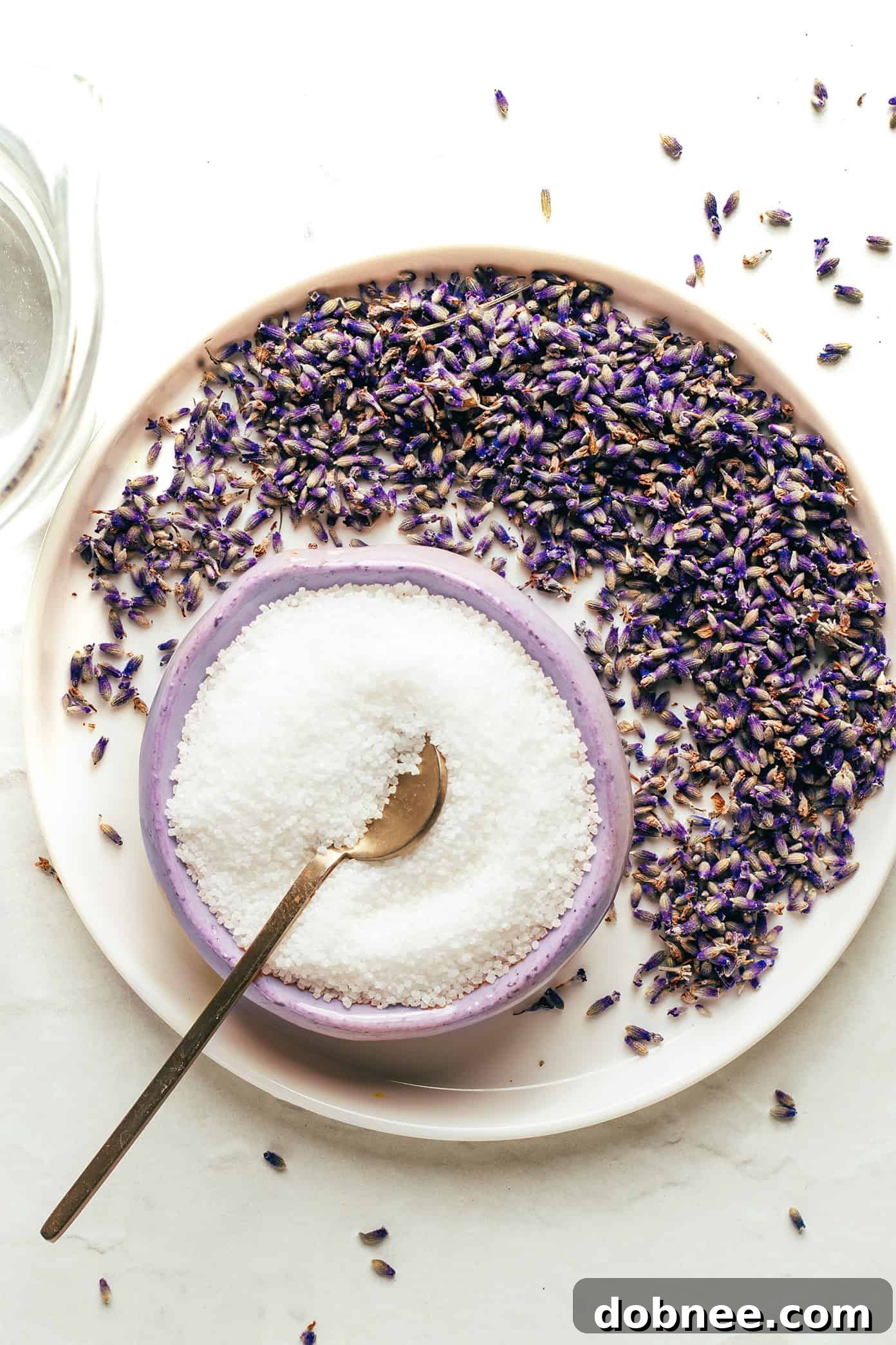 Close-up of dried lavender buds in a bowl, ready for syrup making.