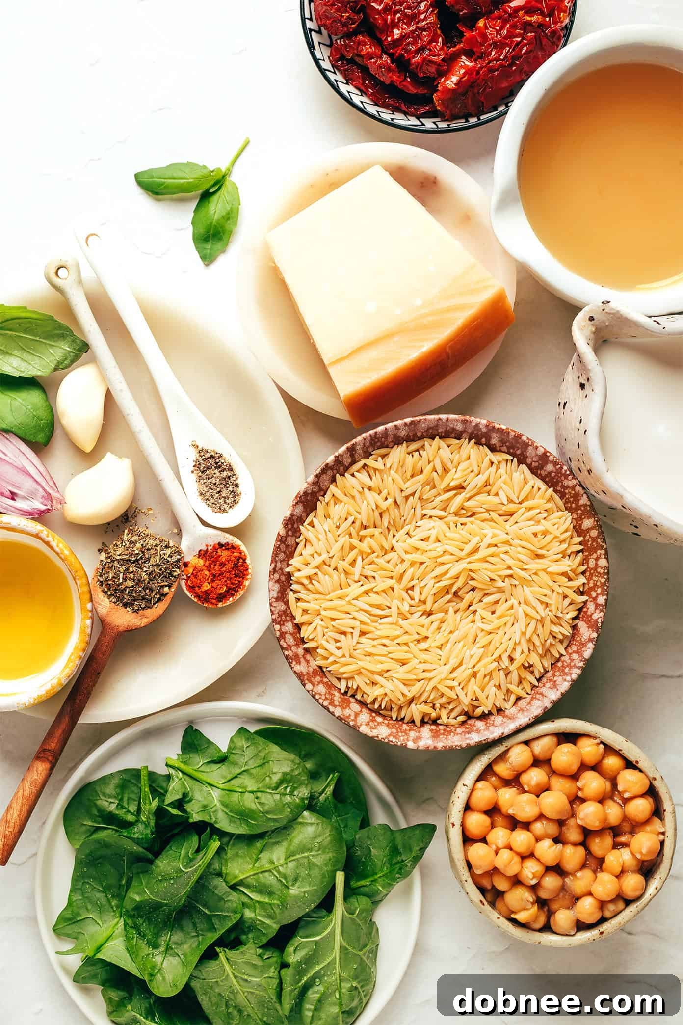 Close-up of Marry Me Chickpeas and Orzo, showing creamy texture and vibrant ingredients