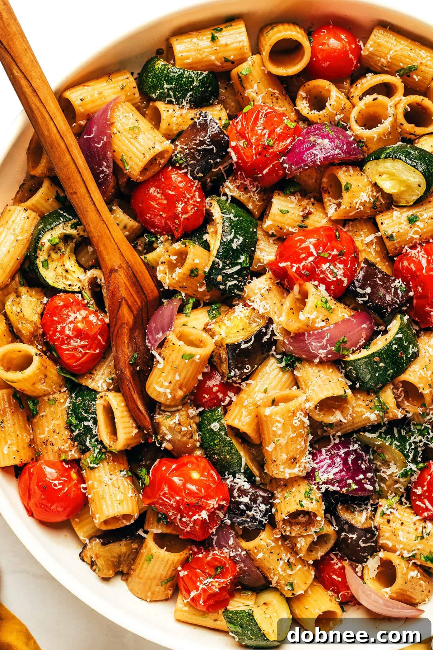 A large skillet with roasted vegetable pasta ready to serve