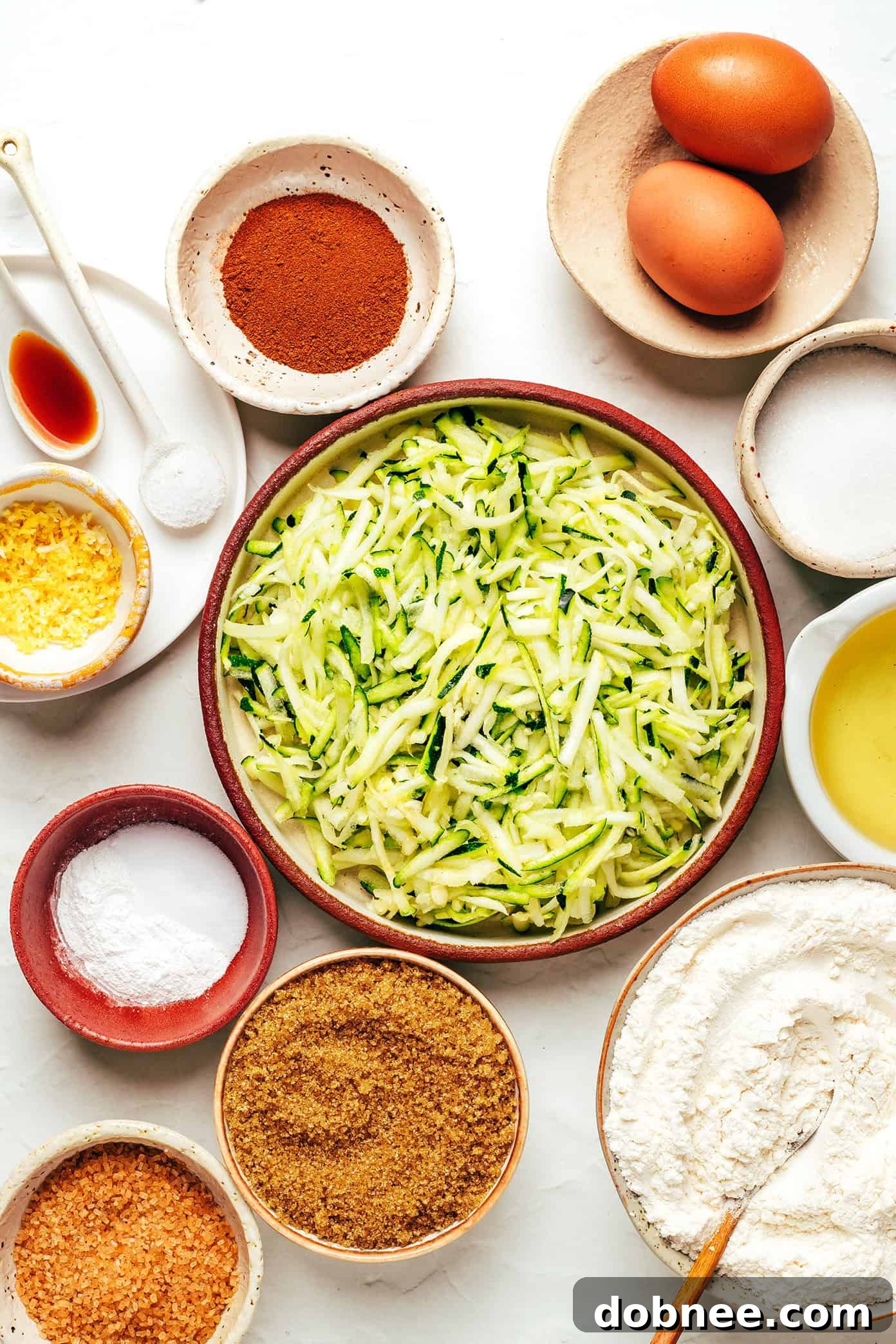 Close-up of a slice of moist zucchini bread revealing green flecks of zucchini.