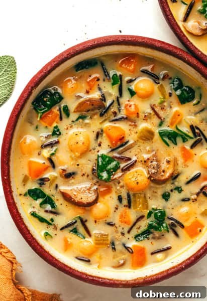 A serving of Pumpkin Wild Rice Soup ready to be enjoyed.