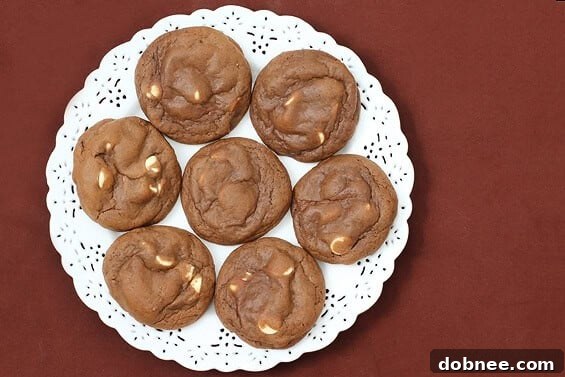 A delicious Bailey's Chocolate Cookie, studded with white chocolate chips, tempting and ready to be enjoyed.