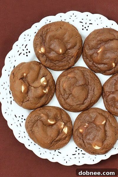 A stack of golden-brown Bailey's Chocolate Cookies on a cooling rack, ready to be enjoyed.