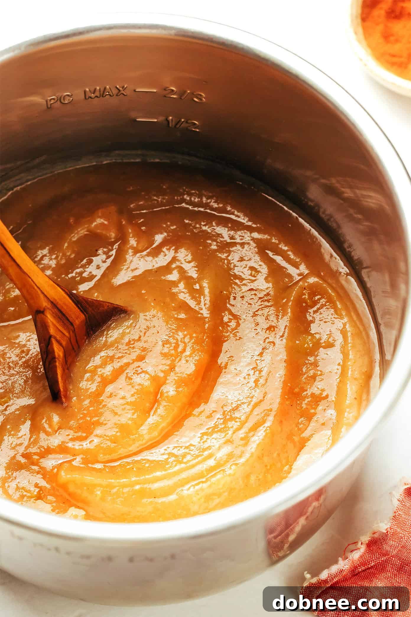 Freshly made Instant Pot applesauce in a bowl, ready to be served.