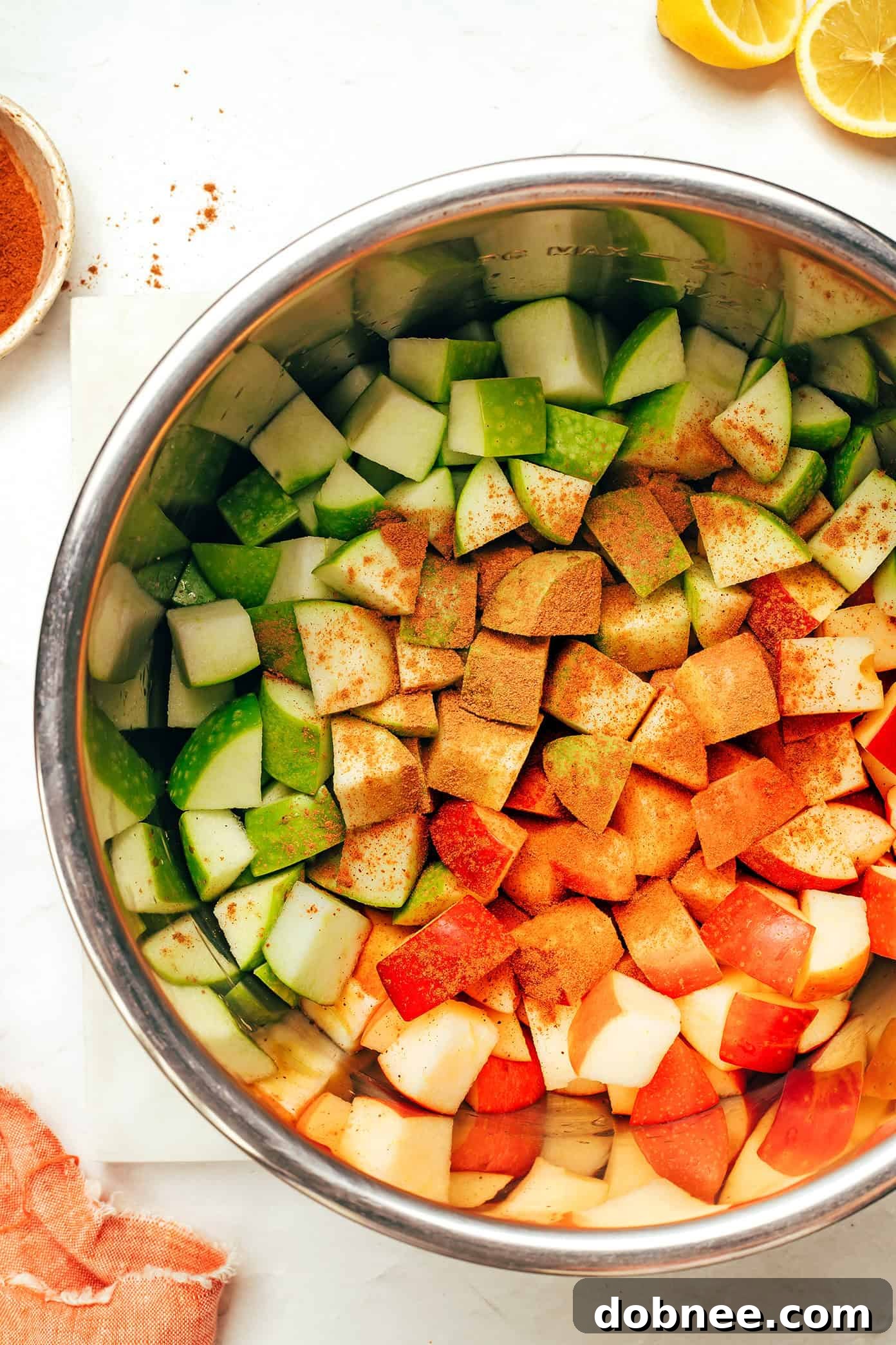 Various applesauce ingredients laid out on a kitchen counter.