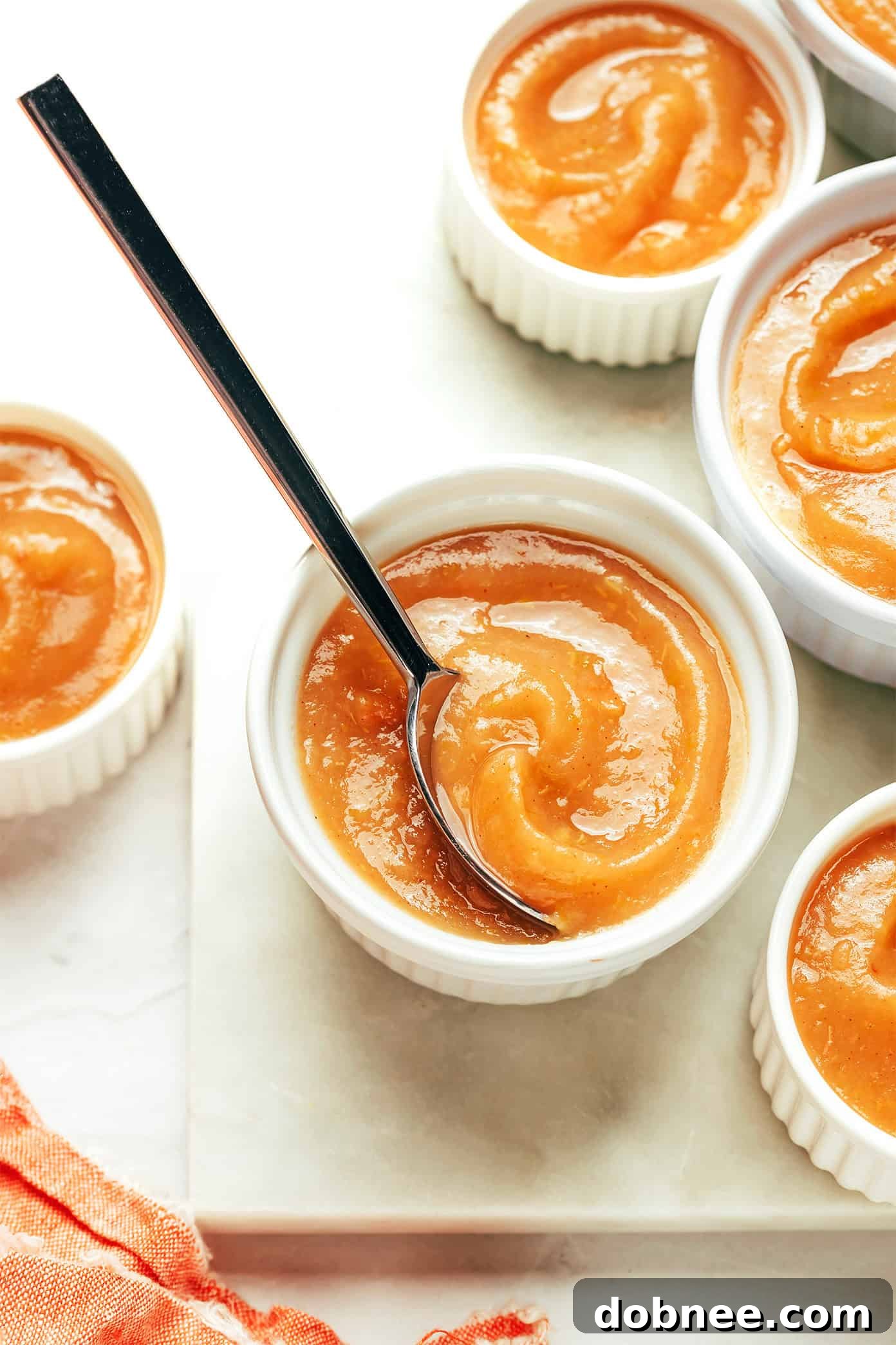 A collection of apple recipes listed, with apples in the foreground.