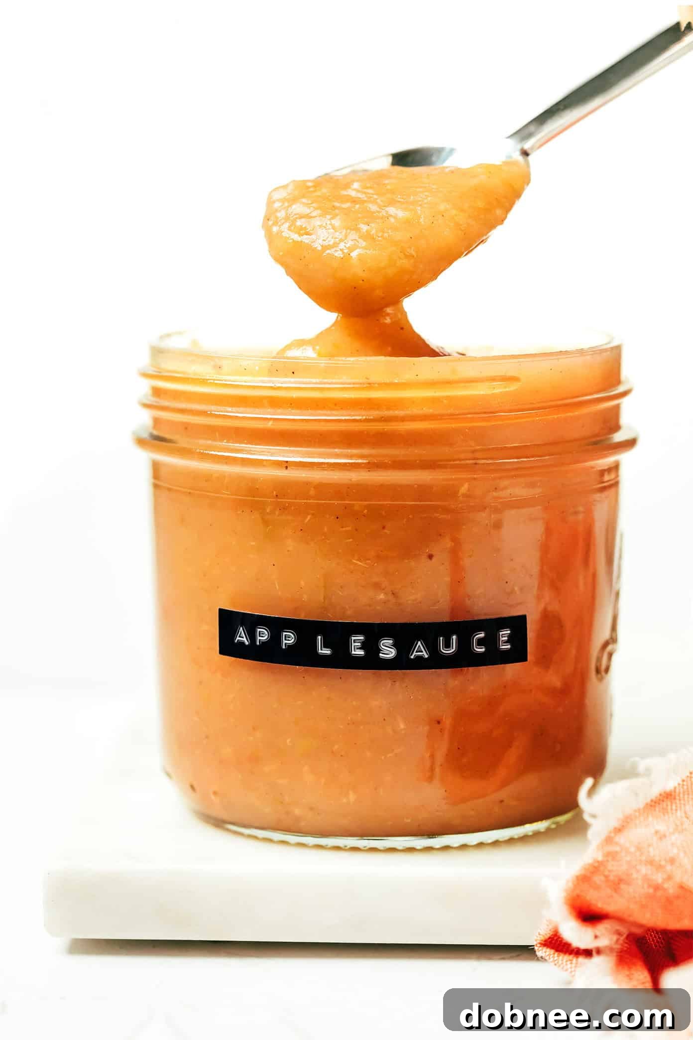 Delicious Instant Pot applesauce served in a small bowl, garnished with cinnamon.