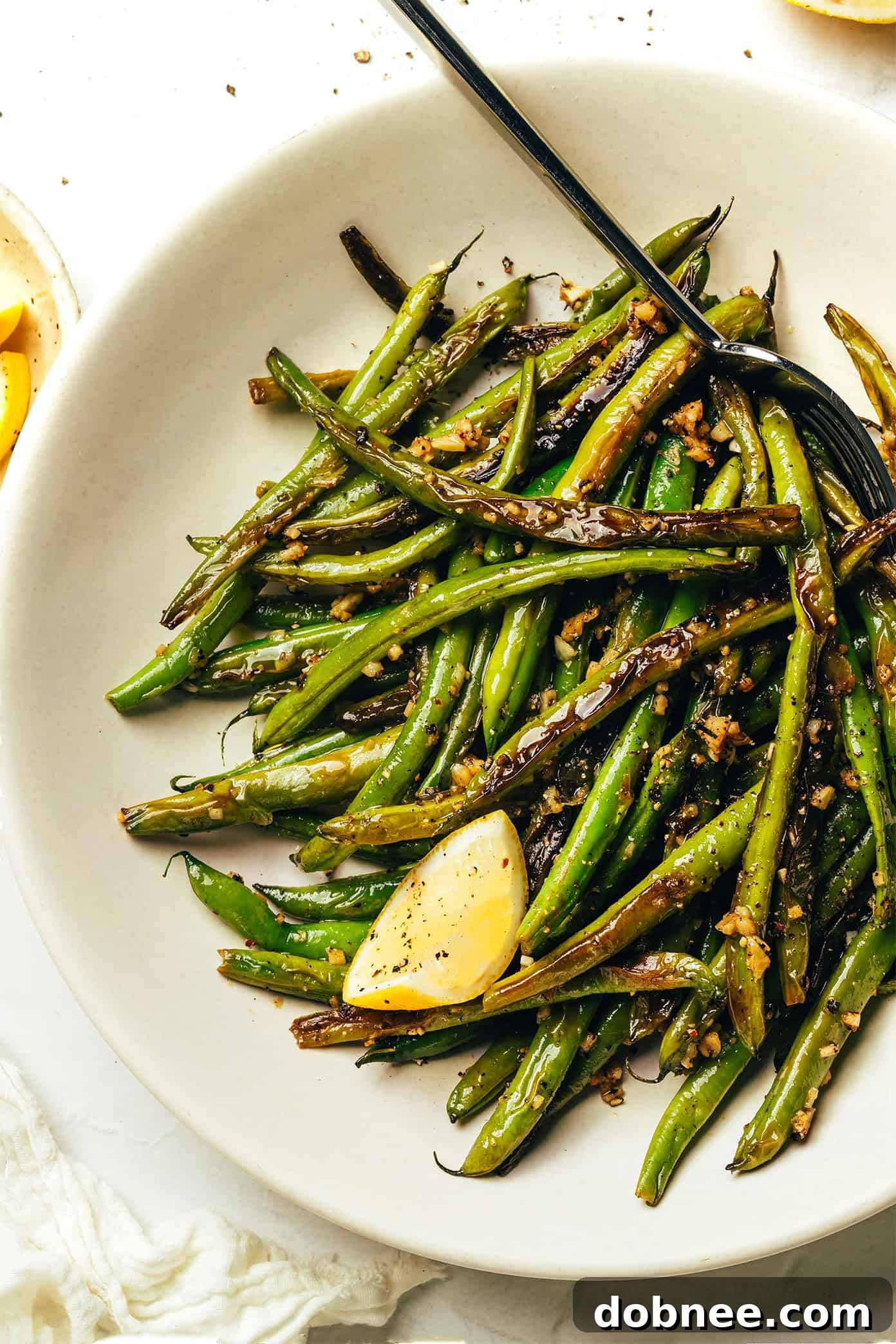 Perfectly blistered garlic green beans in a skillet