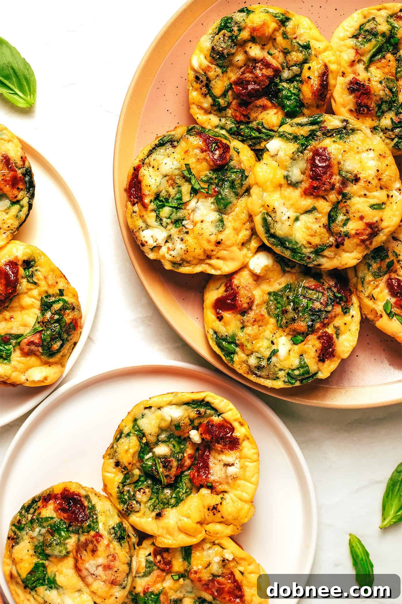 A plate of high-protein egg bites, garnished with fresh herbs.
