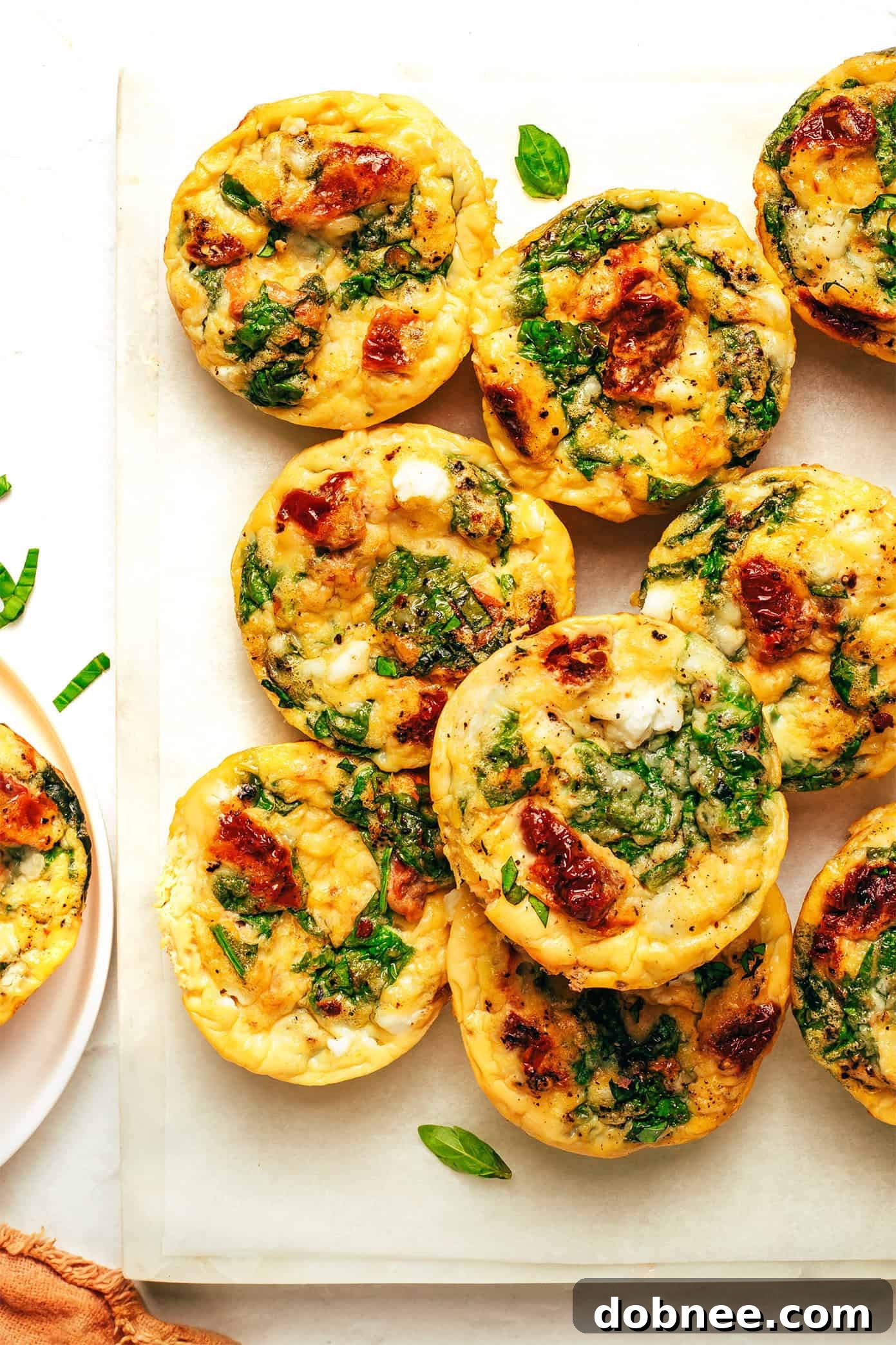 Six high-protein egg bites arranged on a cutting board, ready to eat.