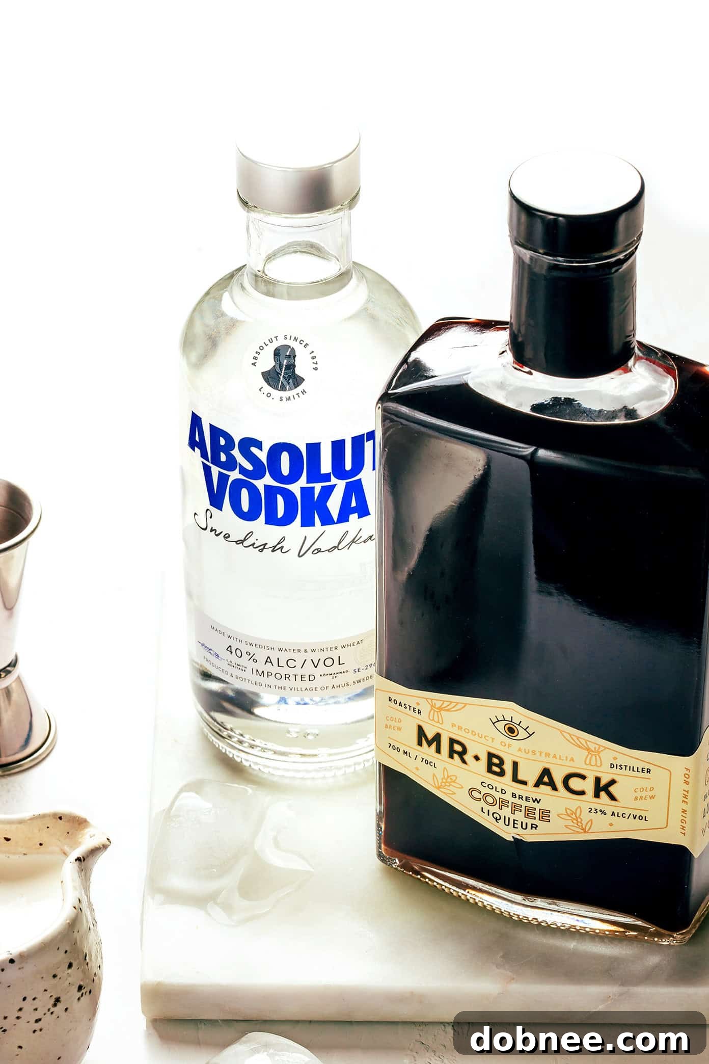 Ingredients for White Russian: Vodka, Kahlua, and Cream