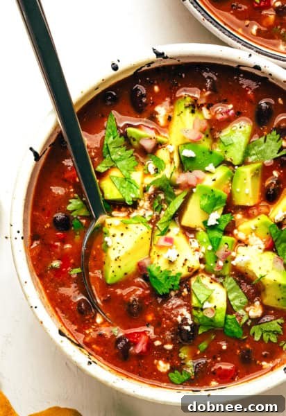 Quick Black Bean Soup in a bowl with toppings