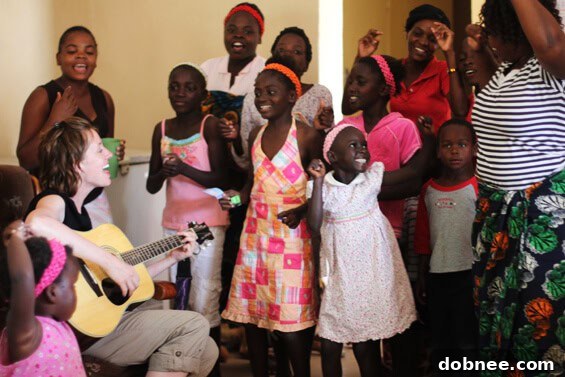 Singing and Jamming in Zambia Children and adults joyfully jamming together with instruments, showcasing the power of music and community in Zambia.