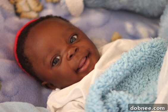 Baby Will, a Miracle Baby Will, a miracle child from the Zambian orphanage, smiling sweetly after being rescued from a pit latrine.