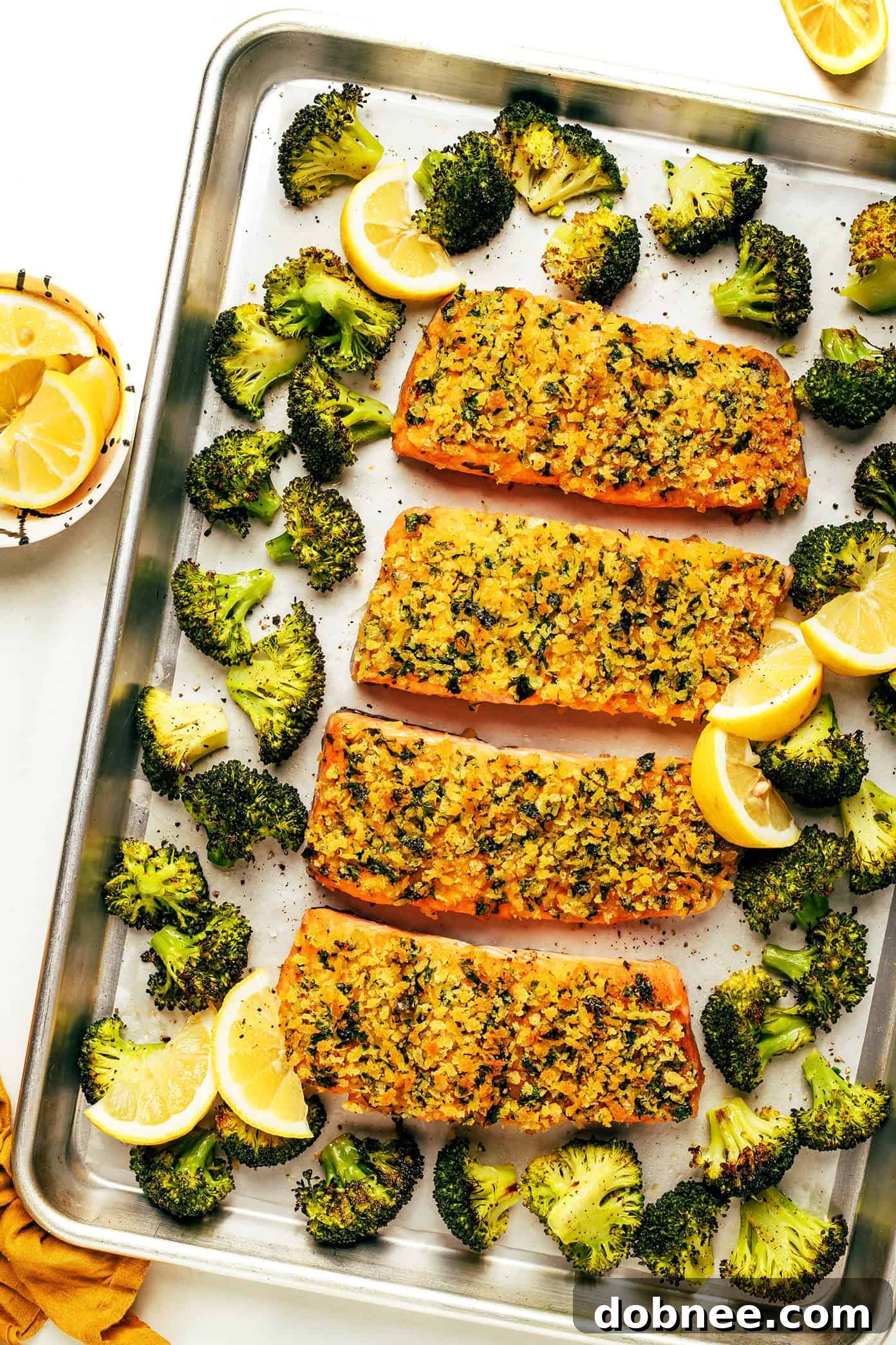 Crispy Honey Mustard Salmon with Roasted Broccoli on a sheet pan, ready to serve.