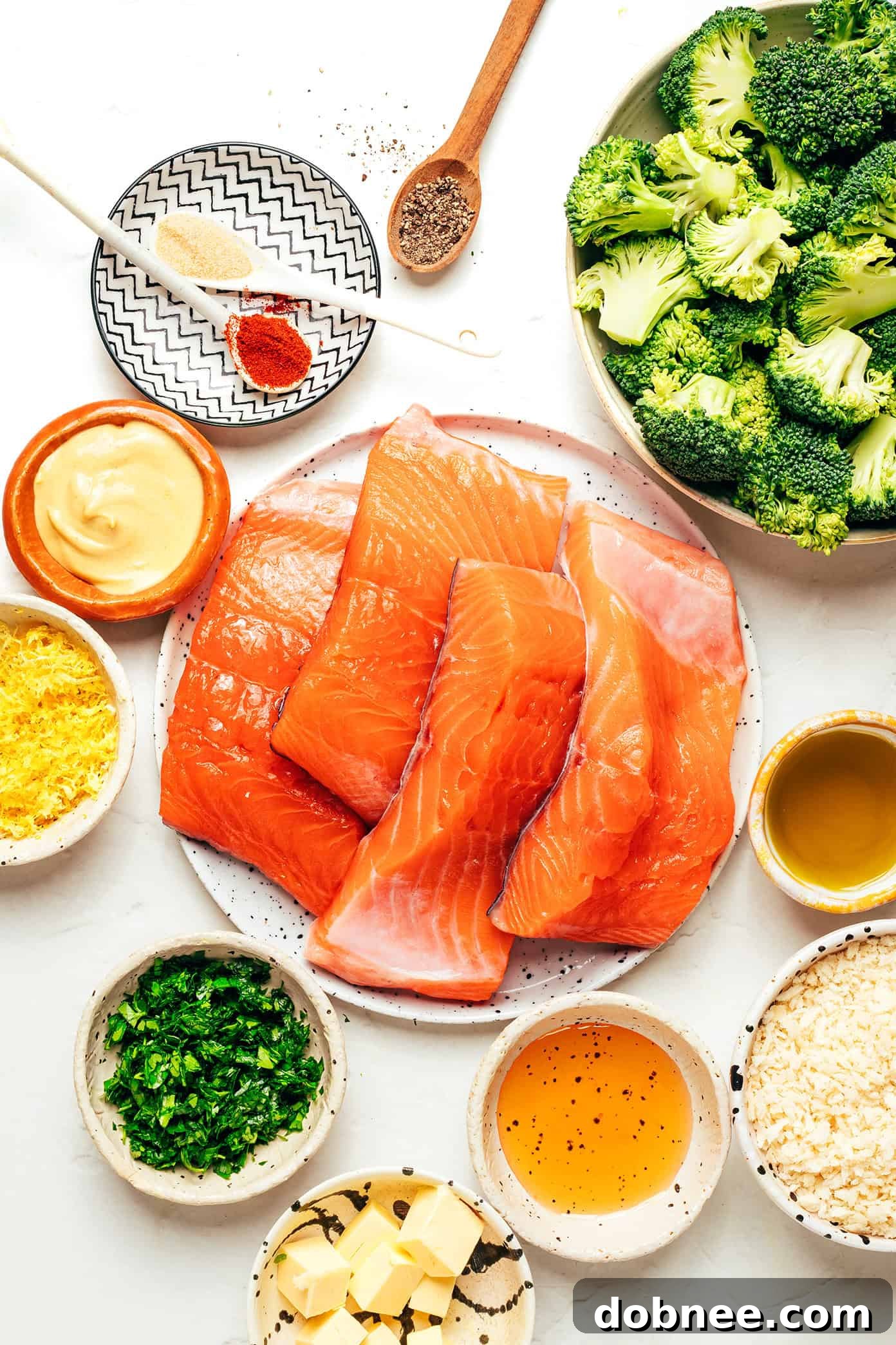 Close-up of crispy honey mustard salmon fillet with a spoon, showing the golden crust.