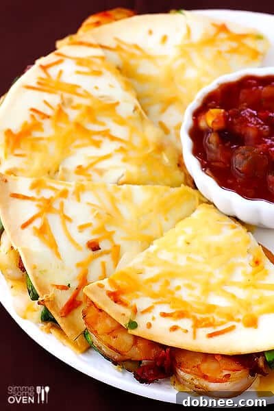 Close-up of a Parmesan-Crusted Shrimp Quesadilla, sliced into wedges