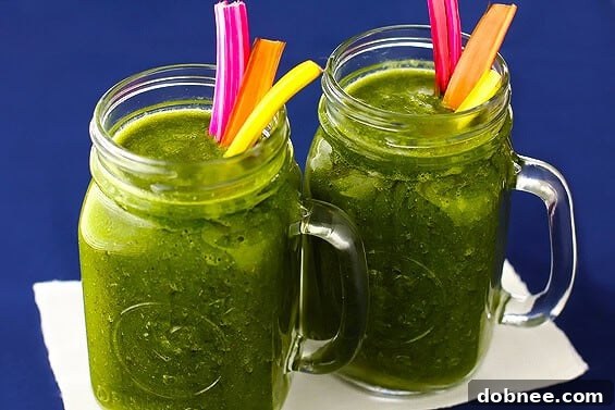 Colorful Rainbow Chard Banana Smoothie in a glass, ready to drink. A healthy and delicious option for any time of day.
