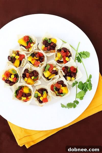 Close-up of Black Bean & Mango Salsa Cups, showcasing fresh ingredients.