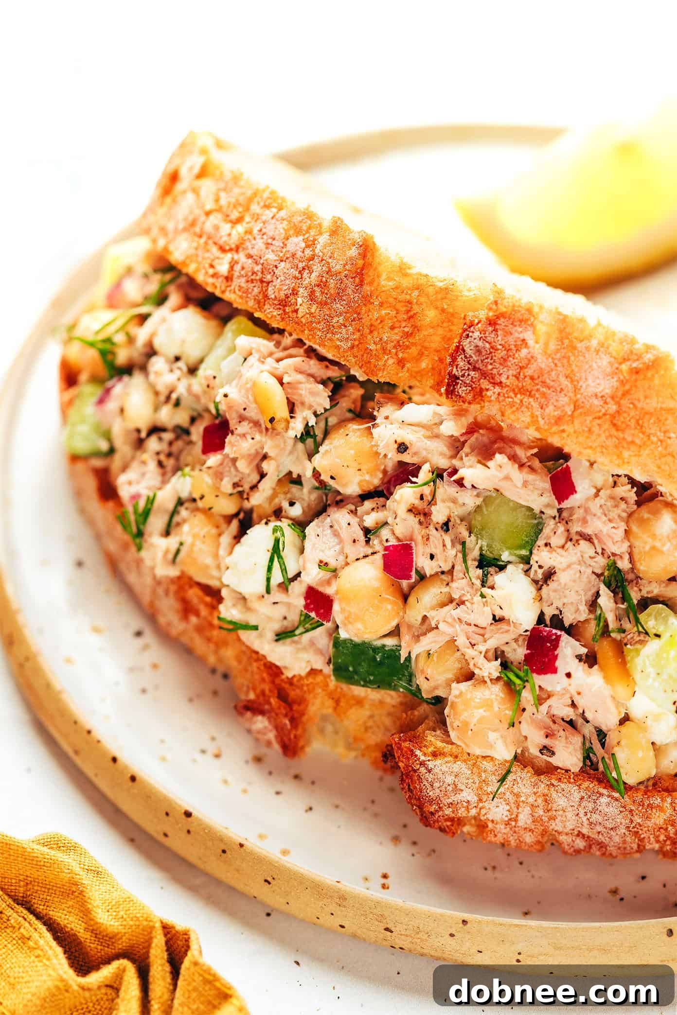 A final close-up of the delicious chickpea tuna salad in a serving bowl, showcasing its freshness.