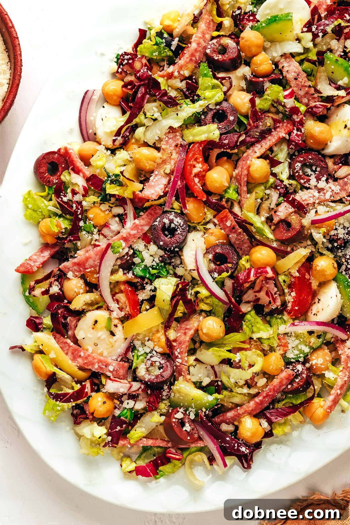 Large serving plate of Italian Chopped Salad, garnished beautifully