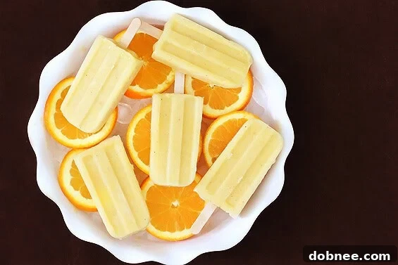 Pineapple Orange Banana Popsicles in molds