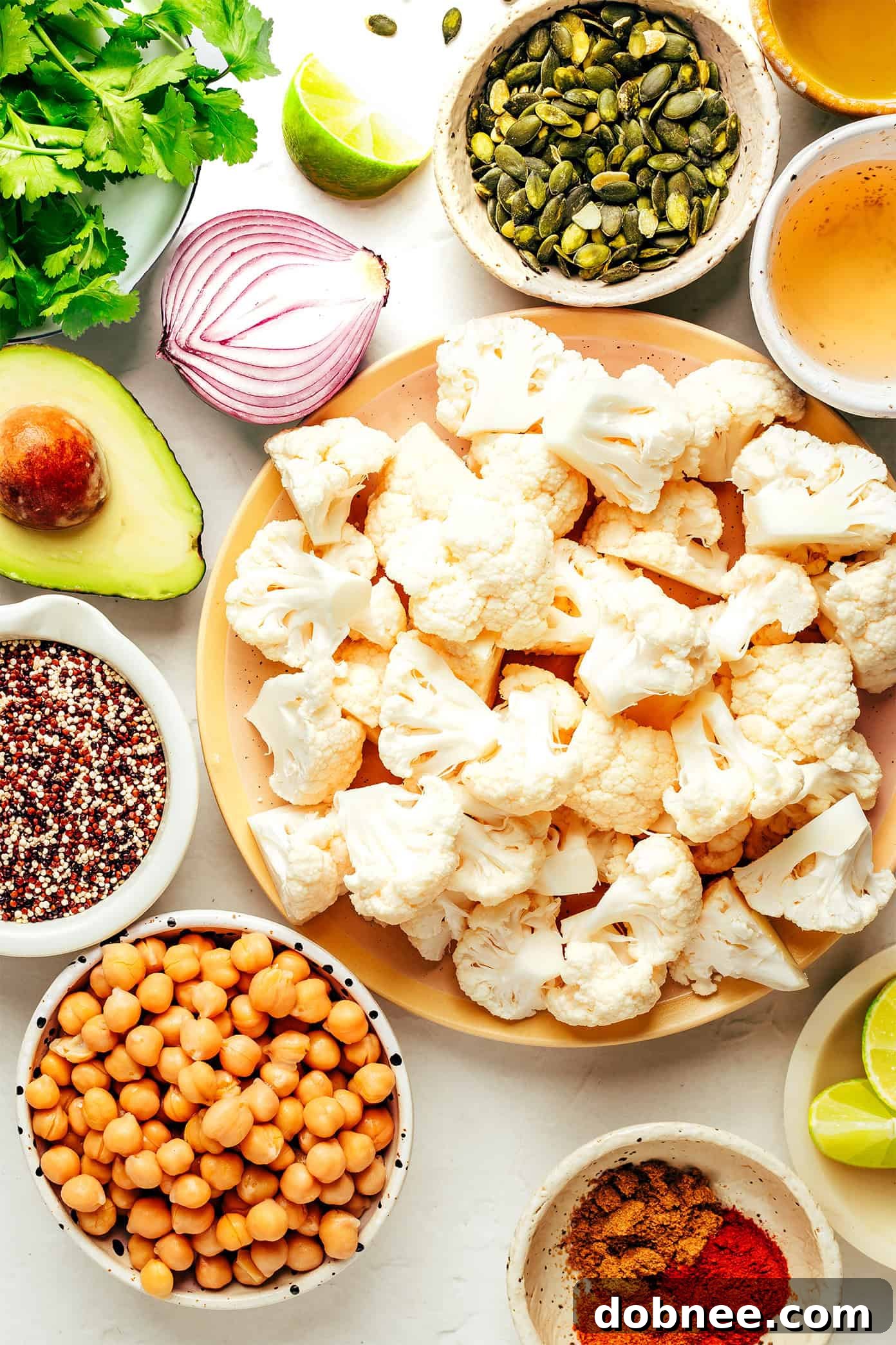 Close-up of the Chili-Lime Roasted Cauliflower, Chickpea, and Quinoa Bowl showing texture and vibrant colors.