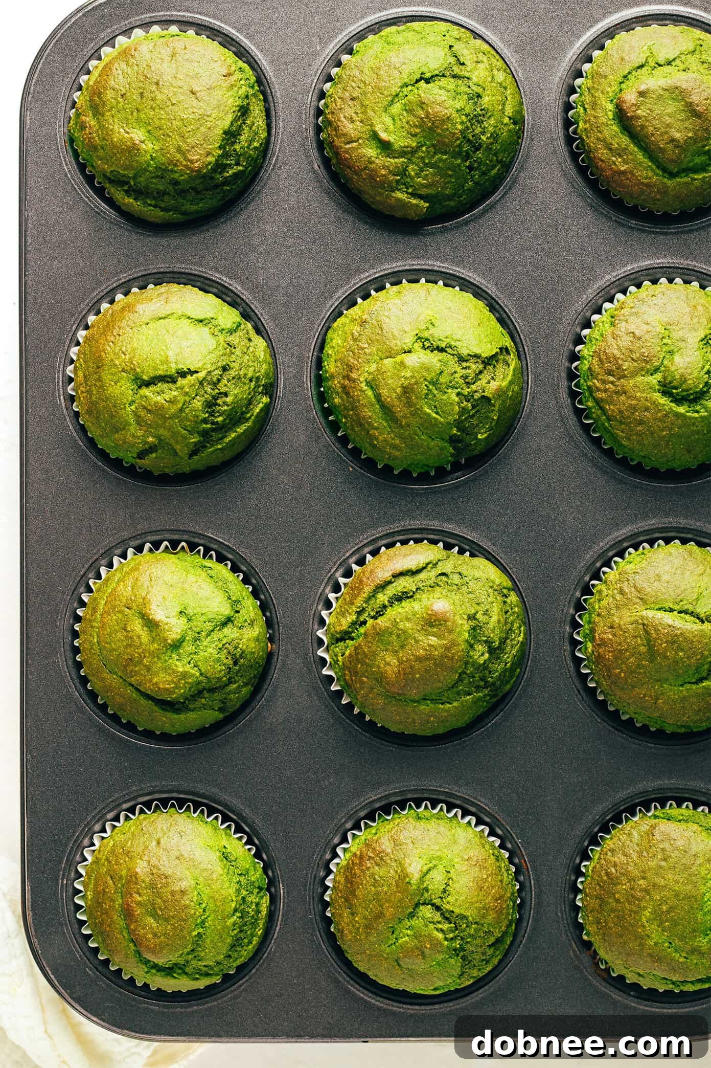 Freshly Baked Green Spinach Banana Muffins in a Pan Green Spinach Banana Muffins in a baking pan