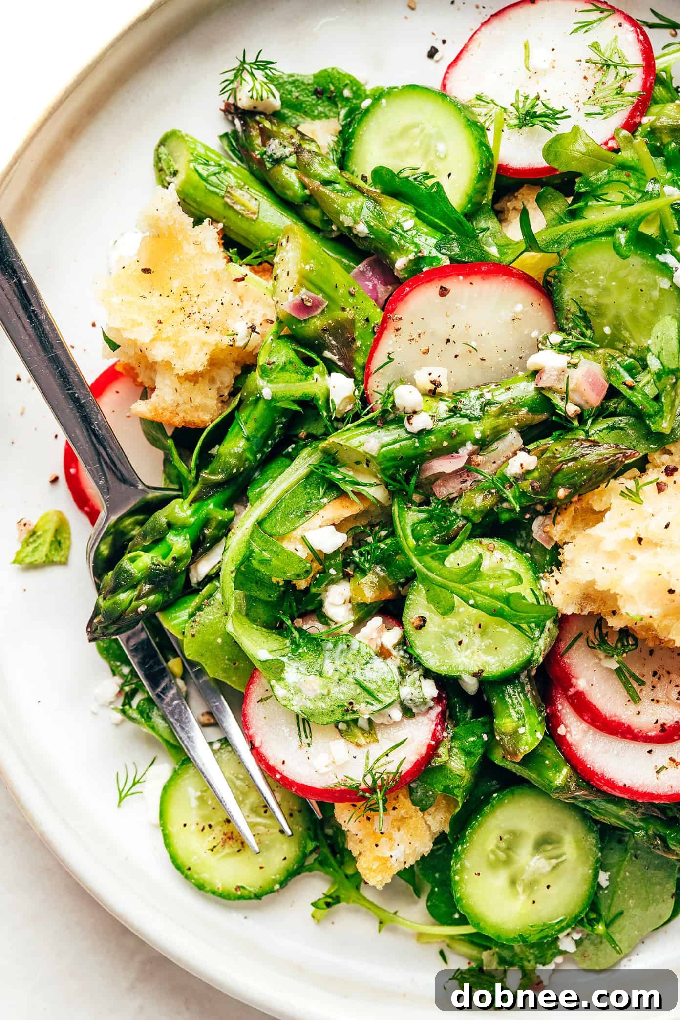 This vibrant spring panzanella salad recipe features crispy sourdough croutons, roasted asparagus, fresh veggies, herbs, feta, and a lemony shallot vinaigrette. | gimmesomeoven.com Spring Panzanella