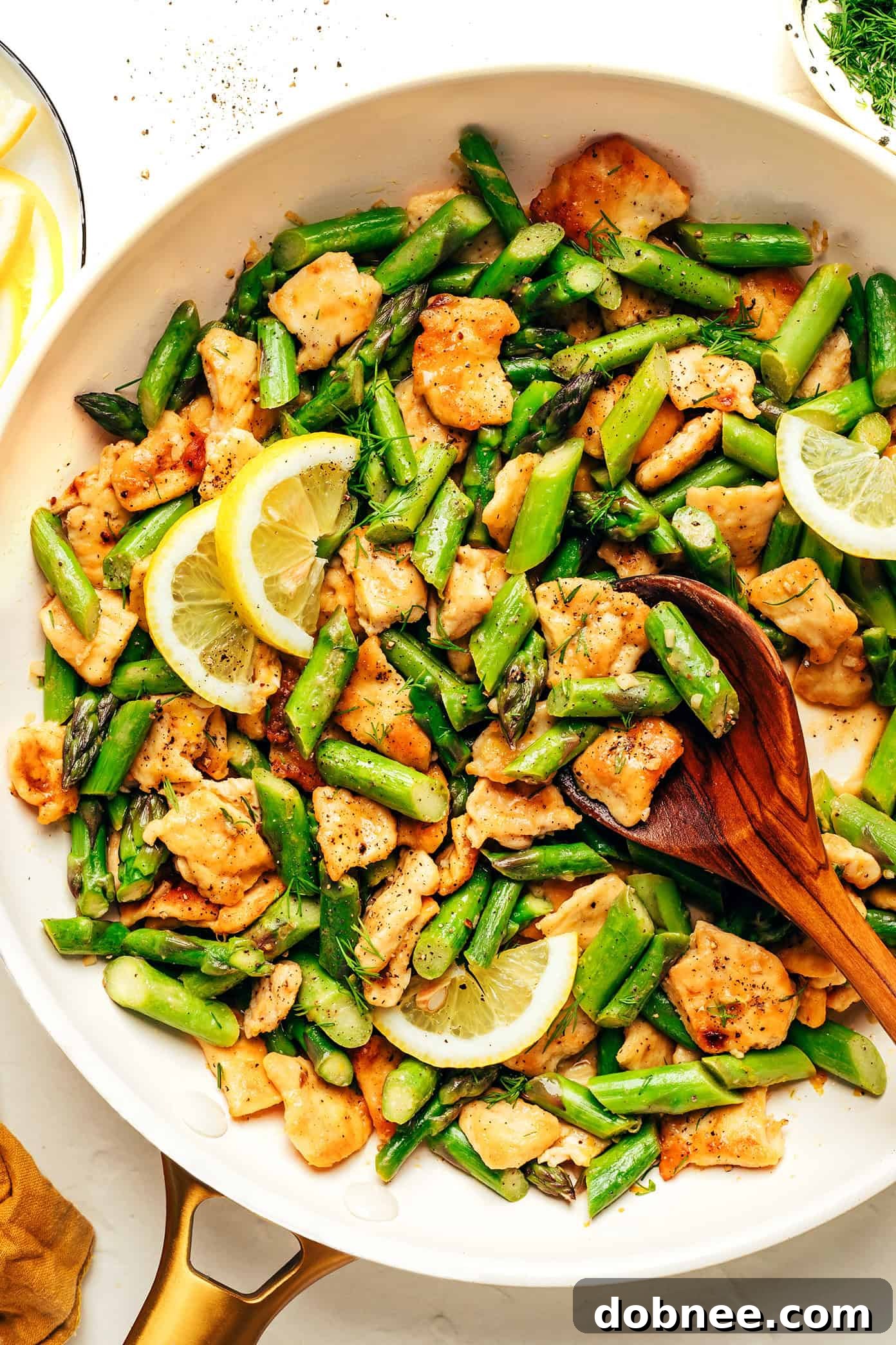 Delicious Lemon Pepper Chicken and Asparagus Stir-fry in a skillet
