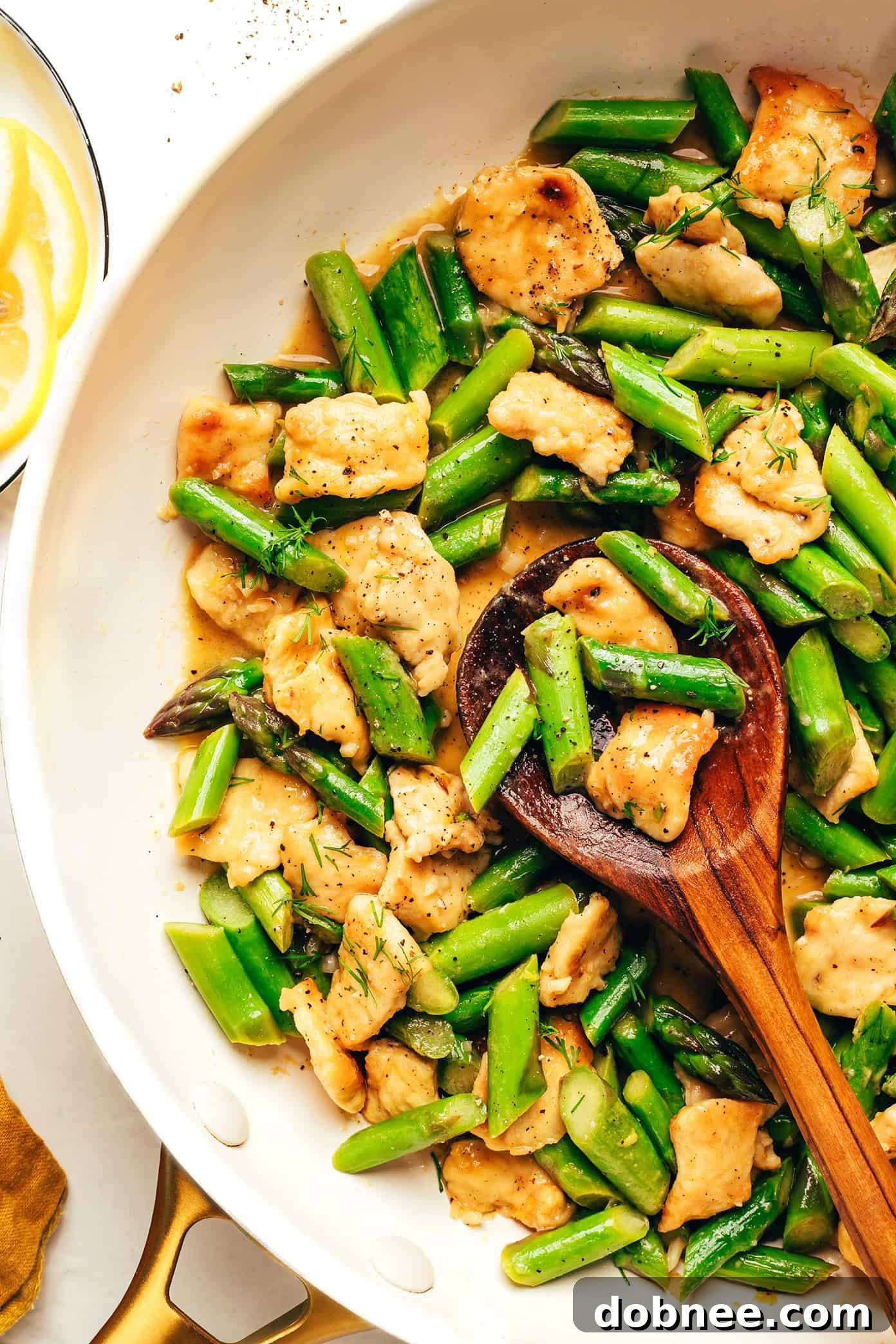 Finished Lemon Pepper Chicken and Asparagus Stir-fry served with rice