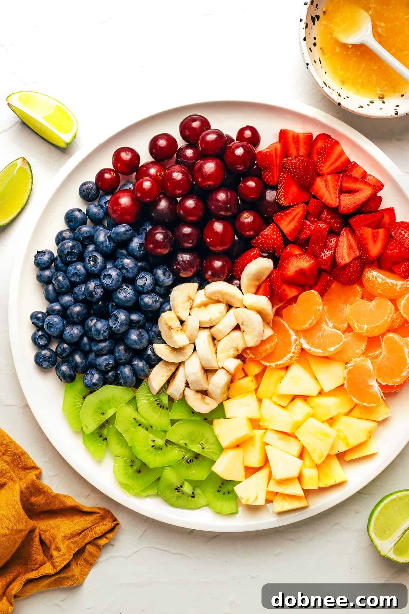 Fresh ingredients for rainbow fruit salad