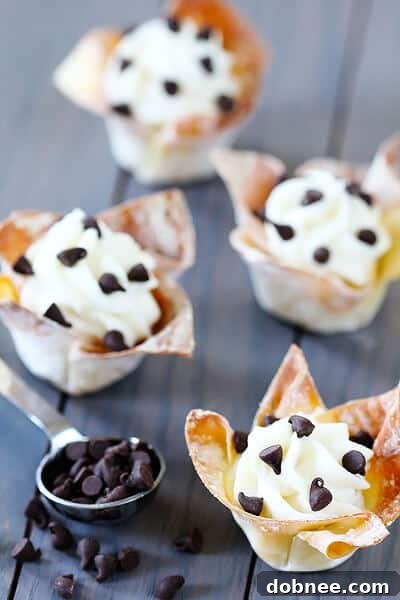 Close-up of golden-brown wonton cups, ready for cannoli filling