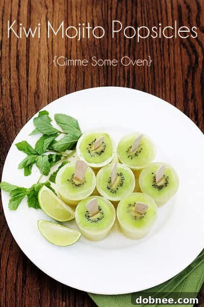 Hands holding a fresh Kiwi Mojito Popsicle outdoors on a sunny day