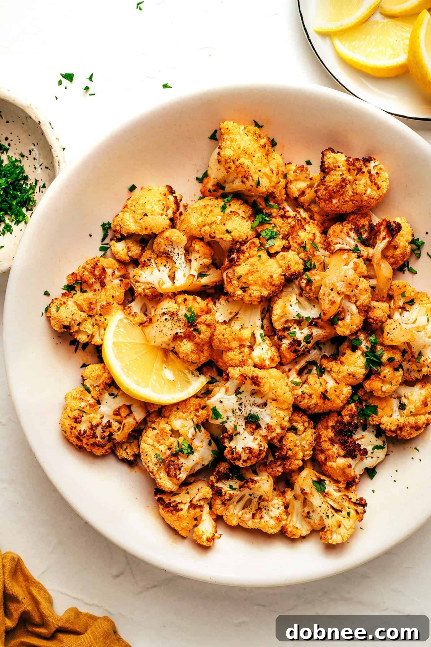 Perfectly crispy air fryer cauliflower florets in a bowl, ready to serve.