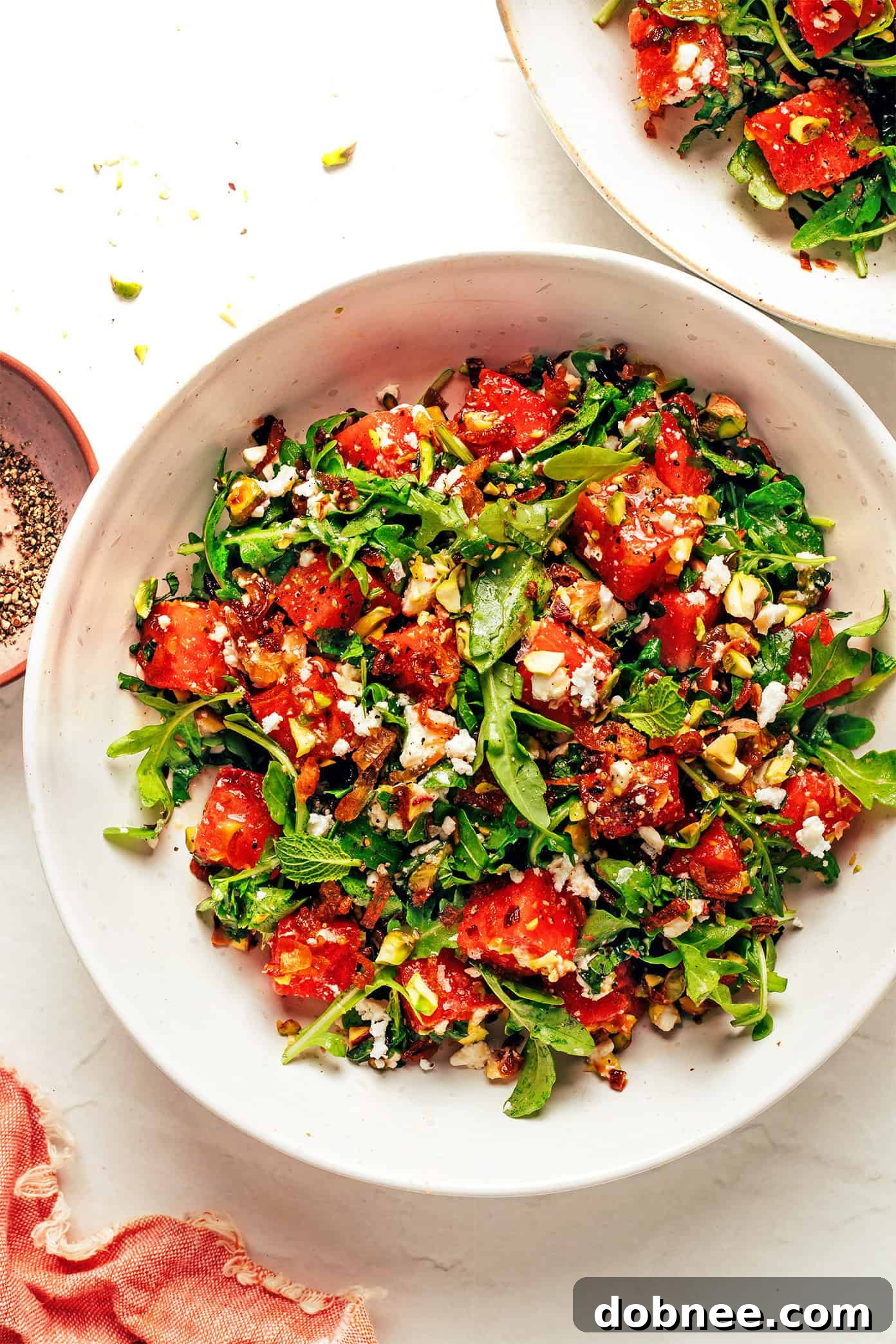 Fresh watermelon arugula salad with feta and crispy shallots